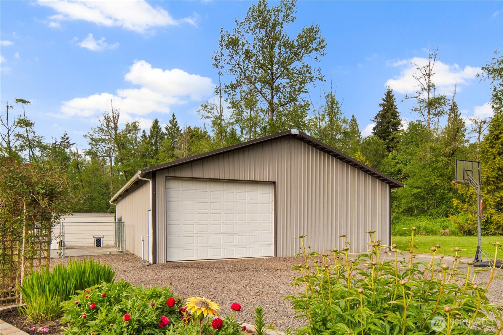 14905 218th Street Southeast Monroe, WA 98272 - Photo 12 of 40 a backyard of a house with lots of green space and garden