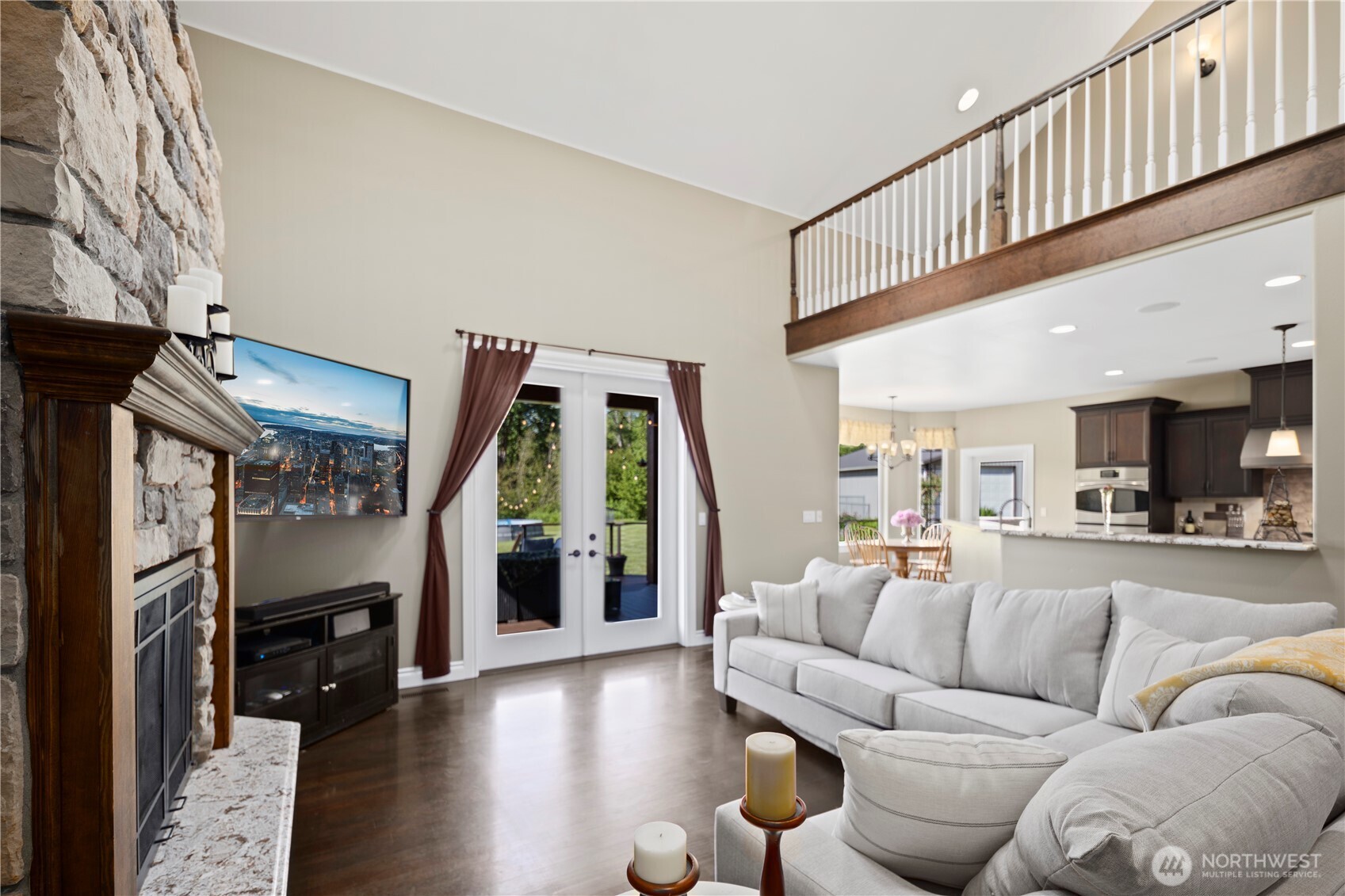 14905 218th Street Southeast Monroe, WA 98272 - Photo 16 of 40 a living room with furniture and a fireplace