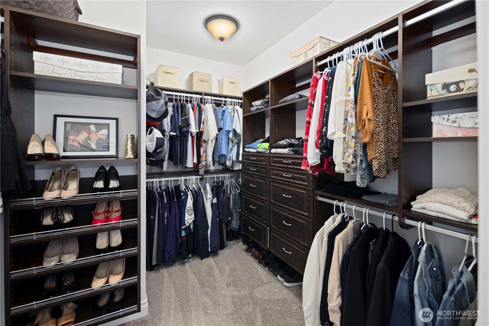 14905 218th Street Southeast Monroe, WA 98272 - Photo 24 of 40 a view of walk in closet with clothes and shoes