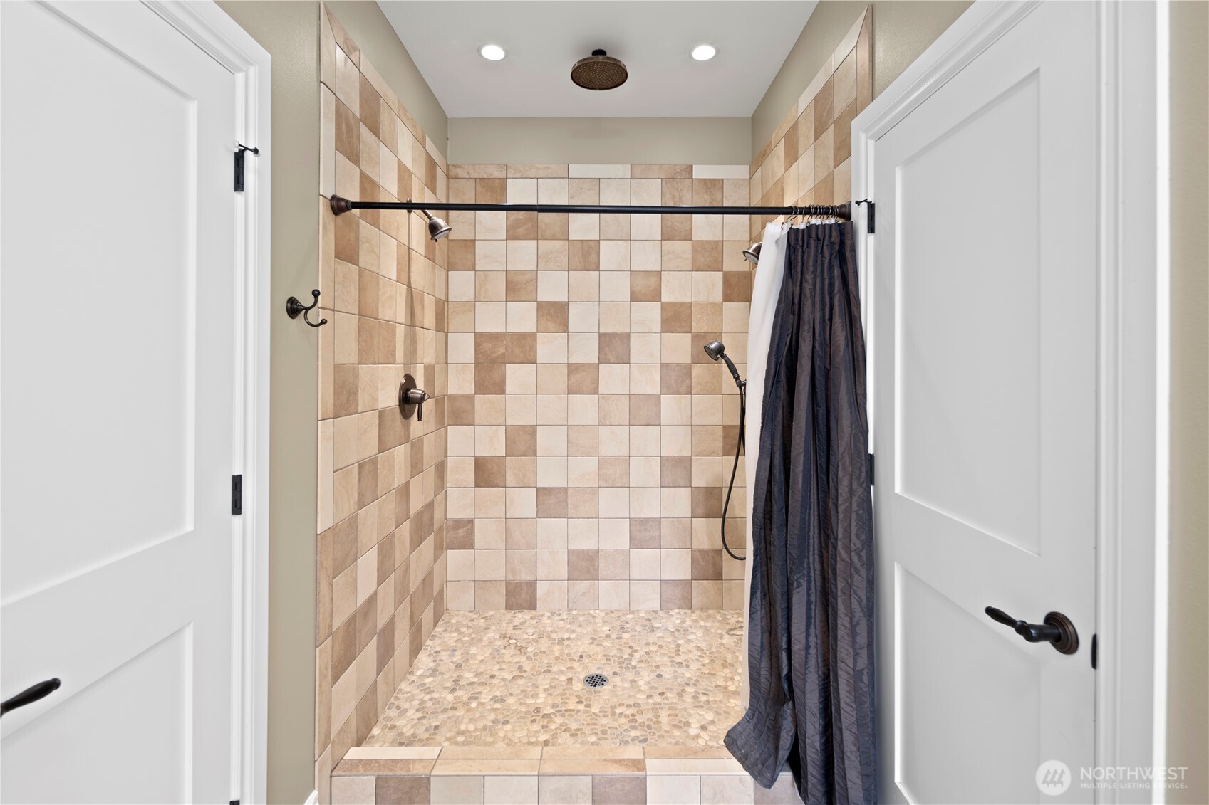 14905 218th Street Southeast Monroe, WA 98272 - Photo 26 of 40 a bathroom with a shower and a glass door