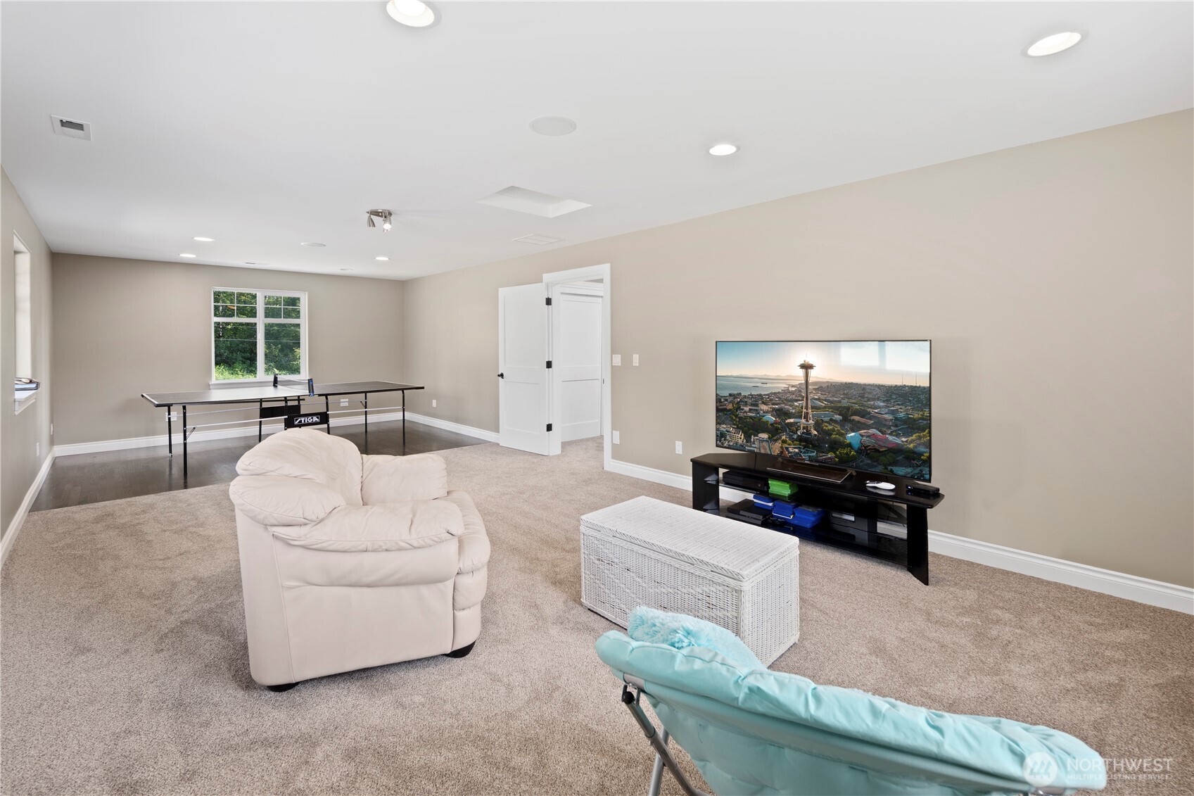 14905 218th Street Southeast Monroe, WA 98272 - Photo 33 of 40 a living room with furniture and a flat screen tv