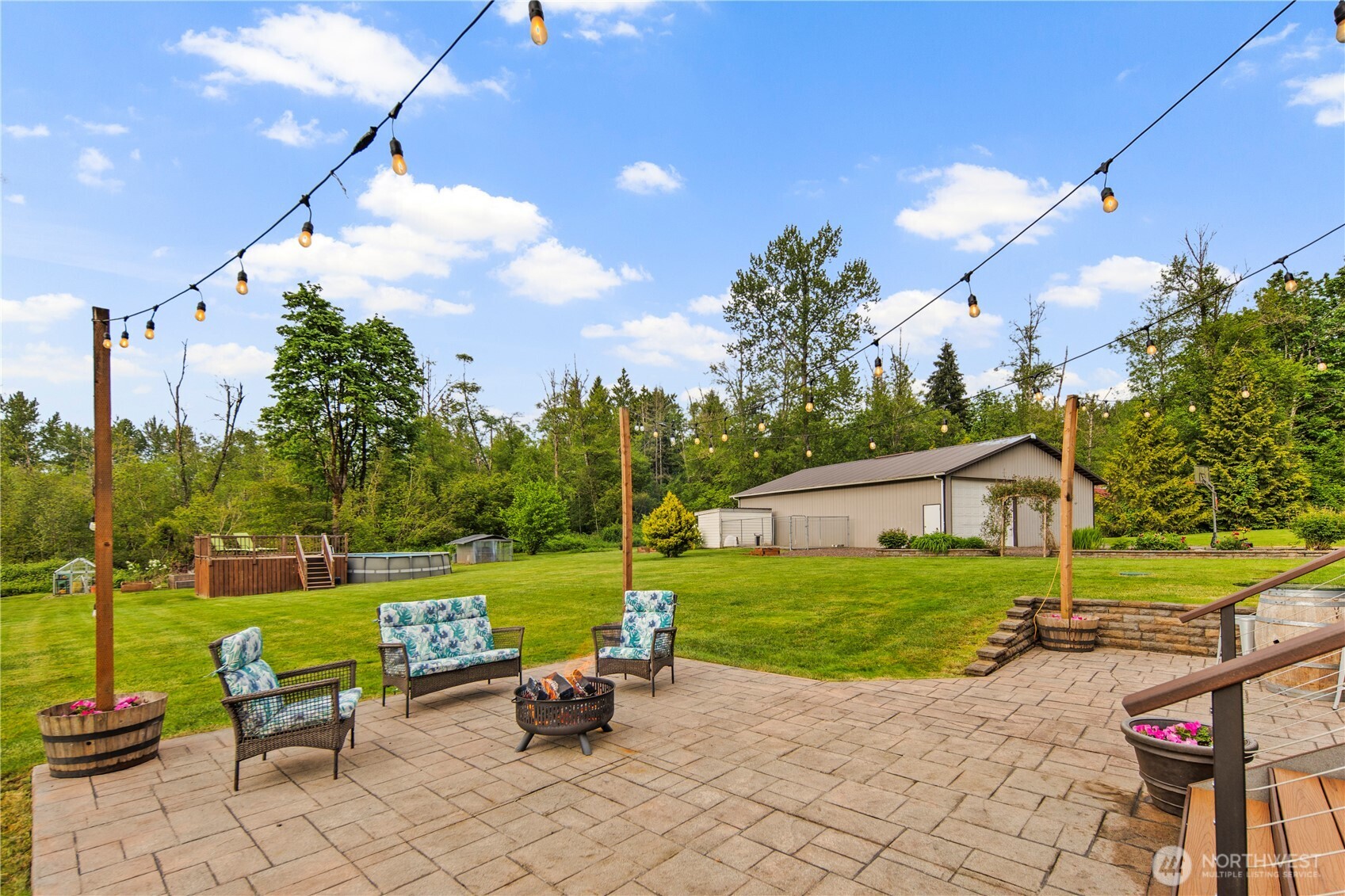 14905 218th Street Southeast Monroe, WA 98272 - Photo 39 of 40 a view of a house with backyard and sitting area