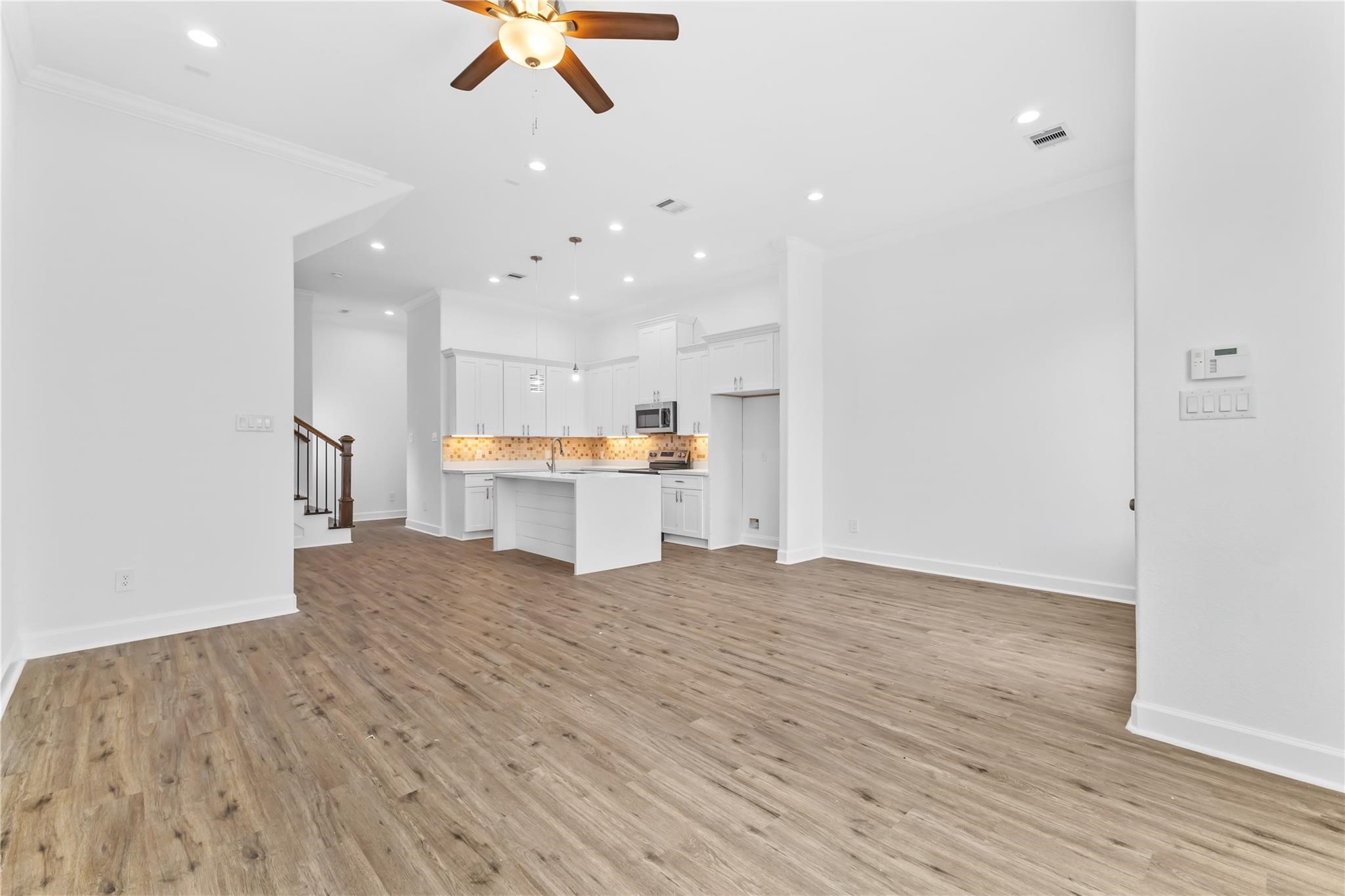 7805 Farnsworth Street, Unit B Houston, TX 77022 - Photo 16 of 26 a view of kitchen with wooden floor