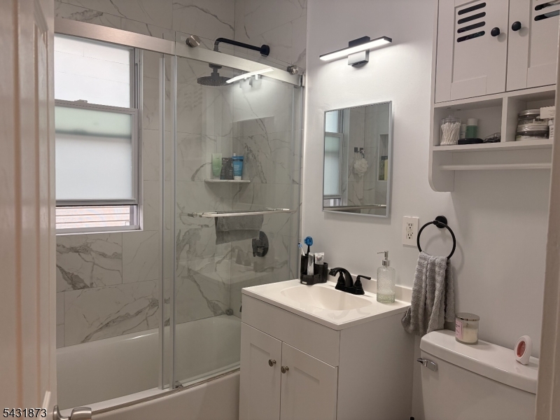 32 Hamilton Avenue, Unit 2 Fairview, NJ 07022 - Photo 6 of 30 a bathroom with a sink toilet and shower