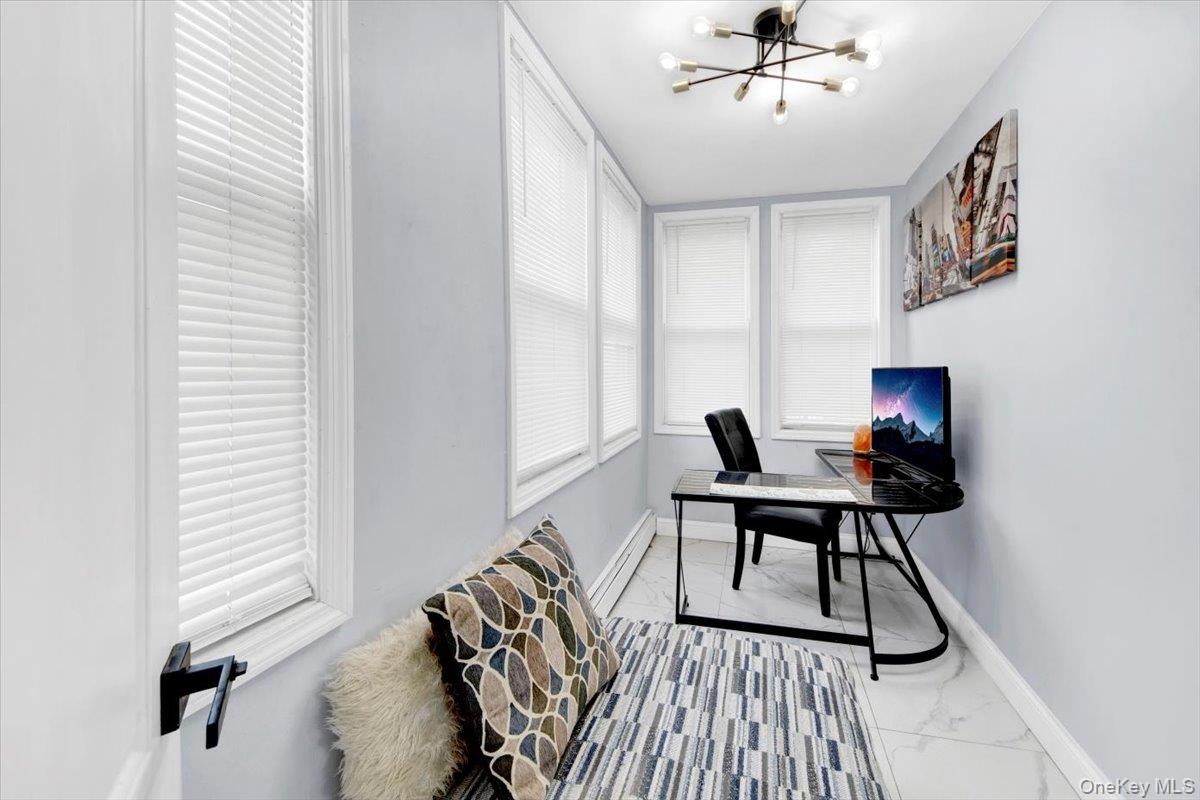 75 West Kingsbridge Road Mount Vernon, NY 10550 - Photo 12 of 37 a workspace with wooden floor and a window