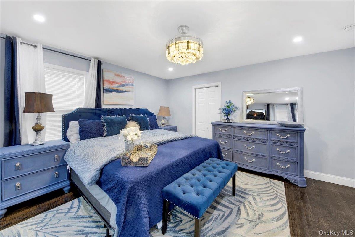 75 West Kingsbridge Road Mount Vernon, NY 10550 - Photo 22 of 37 a bedroom with a bed and a dresser in it