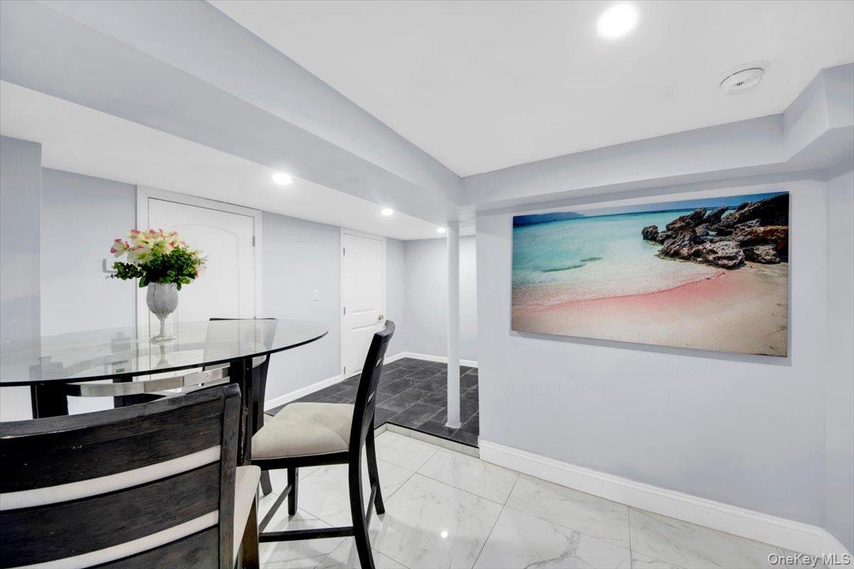 75 West Kingsbridge Road Mount Vernon, NY 10550 - Photo 29 of 37 a view of a livingroom with furniture and a potted plant