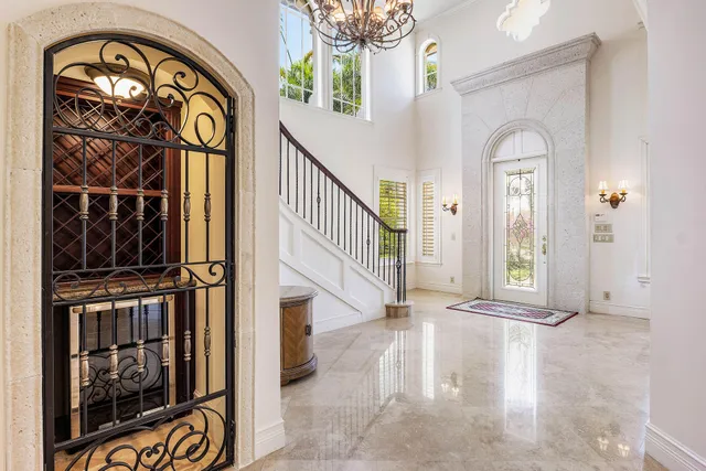a living room with furniture and chandelier