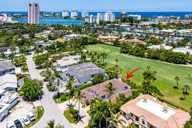 an aerial view of multiple houses with yard