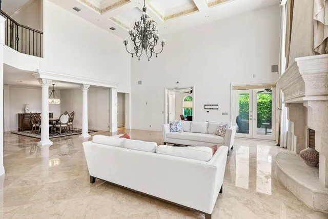 a view of a porch with furniture and garden