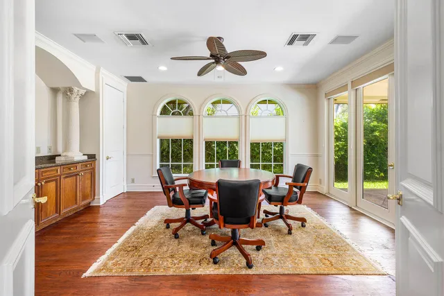 a view of backyard with swimming pool and seating space