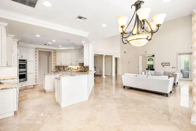 a view of kitchen with furniture and large window