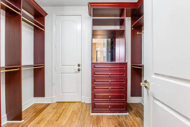 a bed room with a bed and a window