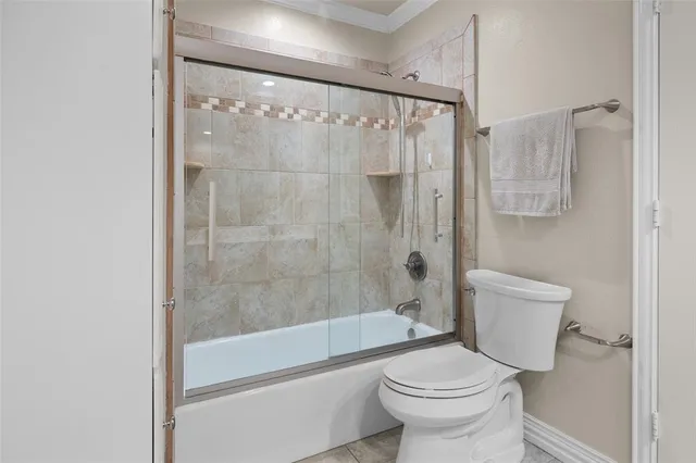 a bathroom with a shower and a toilet