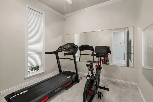 a view of gym equipment with windows