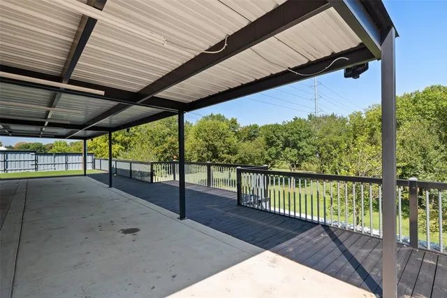a view of balcony with wooden floor
