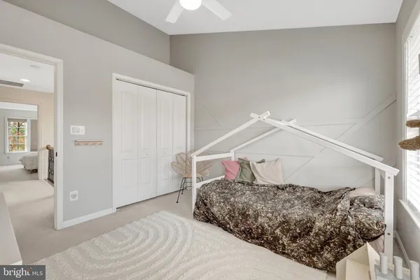 a bedroom with a bed and walk in closet