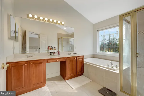 a bathroom with a bathtub and a shower