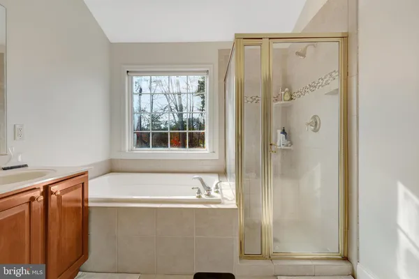 a bathroom with a double vanity sink and mirror