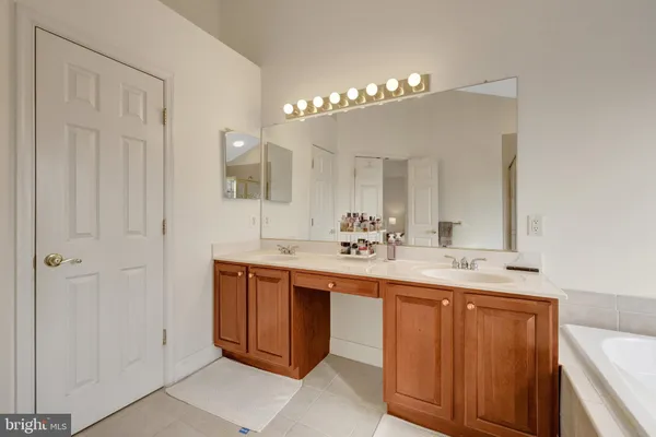a utility room with sink dryer and washer