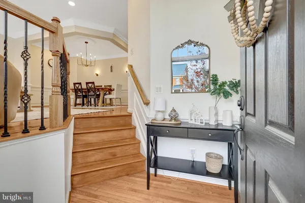 a view of entryway livingroom and hall with wooden floor