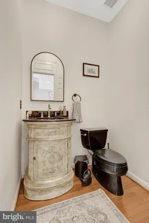 a living room with a couch and chairs