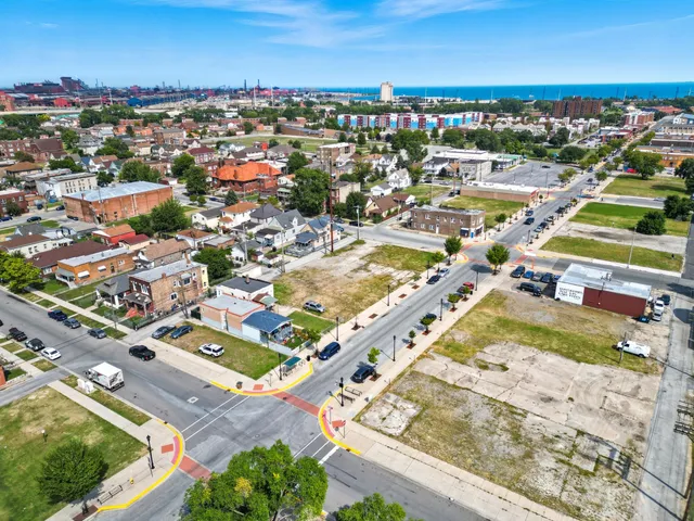 an aerial view of residential houses with outdoor space