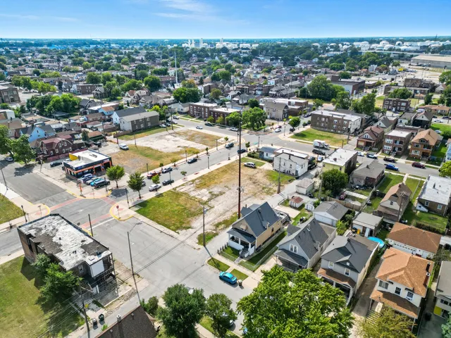an aerial view of residential houses with outdoor space