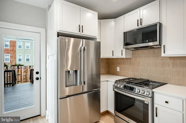 a kitchen with a stove and a microwave