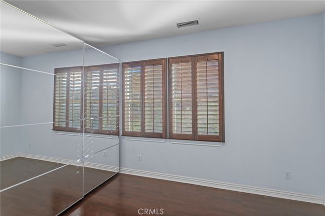 a view of a livingroom with furniture and wooden floor