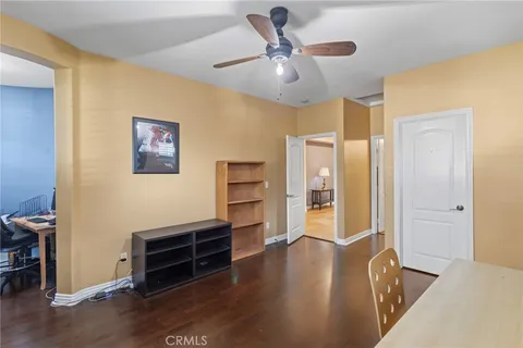 a view of a hallway with entryway to a bedroom