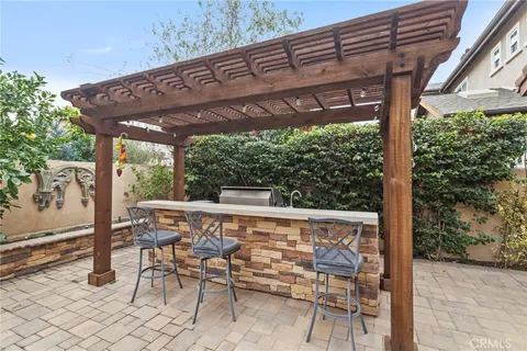 a front view of a house with sitting area