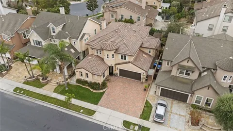 an aerial view of a residential houses with outdoor space