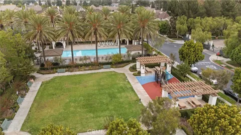 a front view of a house with yard and outdoor seating