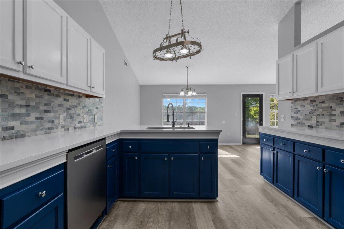 427 Triton Street Crestview, FL 32536 - Photo 16 of 43 a kitchen with a sink and cabinets
