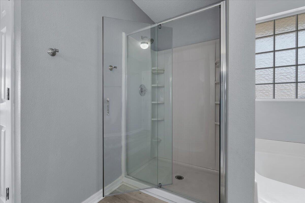 427 Triton Street Crestview, FL 32536 - Photo 25 of 43 a bathroom with a glass shower door
