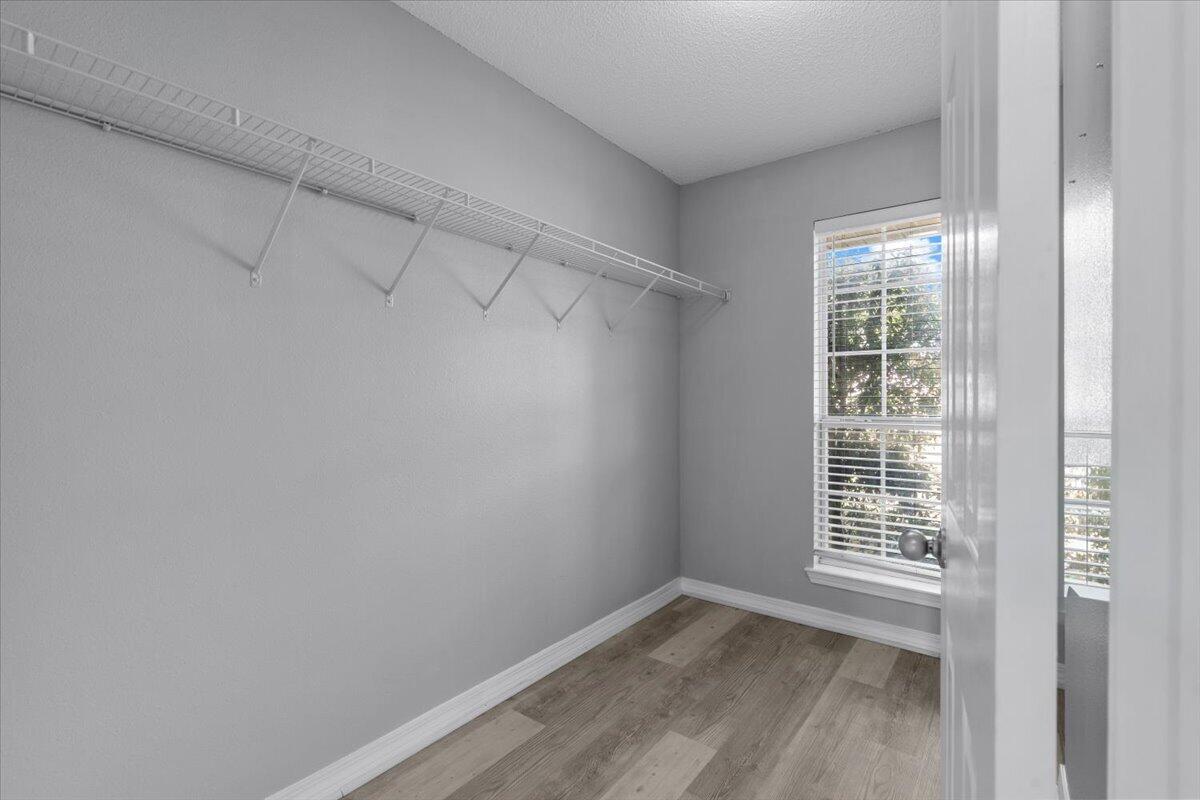 427 Triton Street Crestview, FL 32536 - Photo 26 of 43 a view of a small space with wooden floor and a window