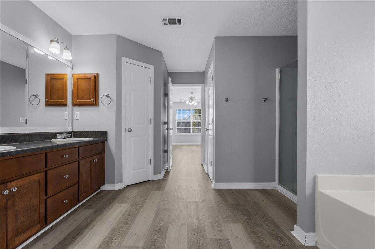 427 Triton Street Crestview, FL 32536 - Photo 27 of 43 a bathroom with a sink a mirror and shower