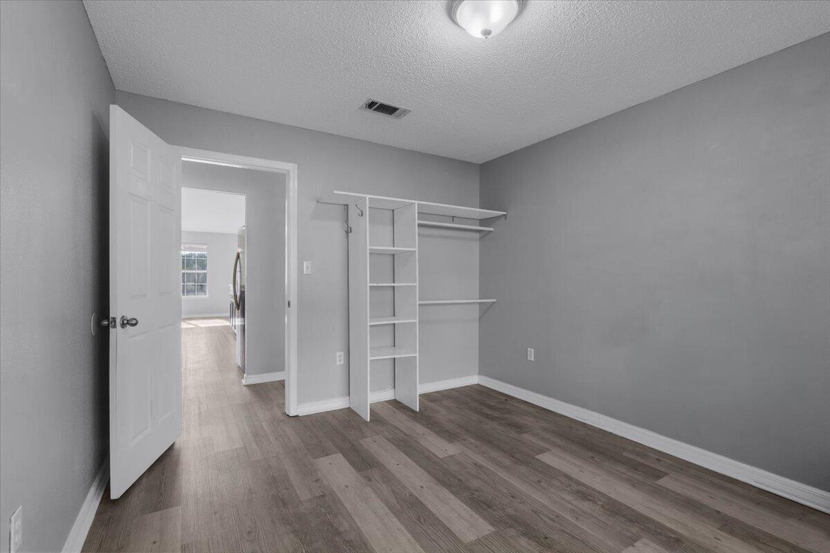 427 Triton Street Crestview, FL 32536 - Photo 31 of 43 wooden floor in an empty room