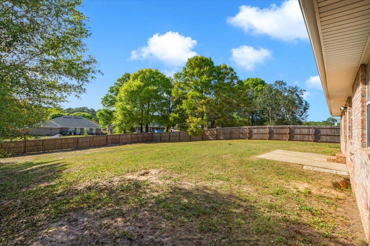 427 Triton Street Crestview, FL 32536 - Photo 37 of 43 a view of a swimming pool with an outdoor space and seating area