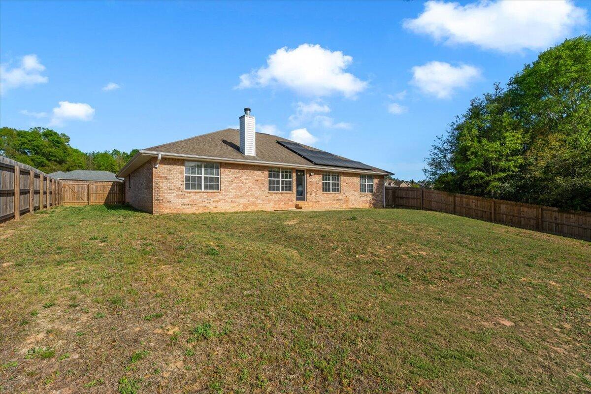 427 Triton Street Crestview, FL 32536 - Photo 41 of 43 a front view of a house with a garden
