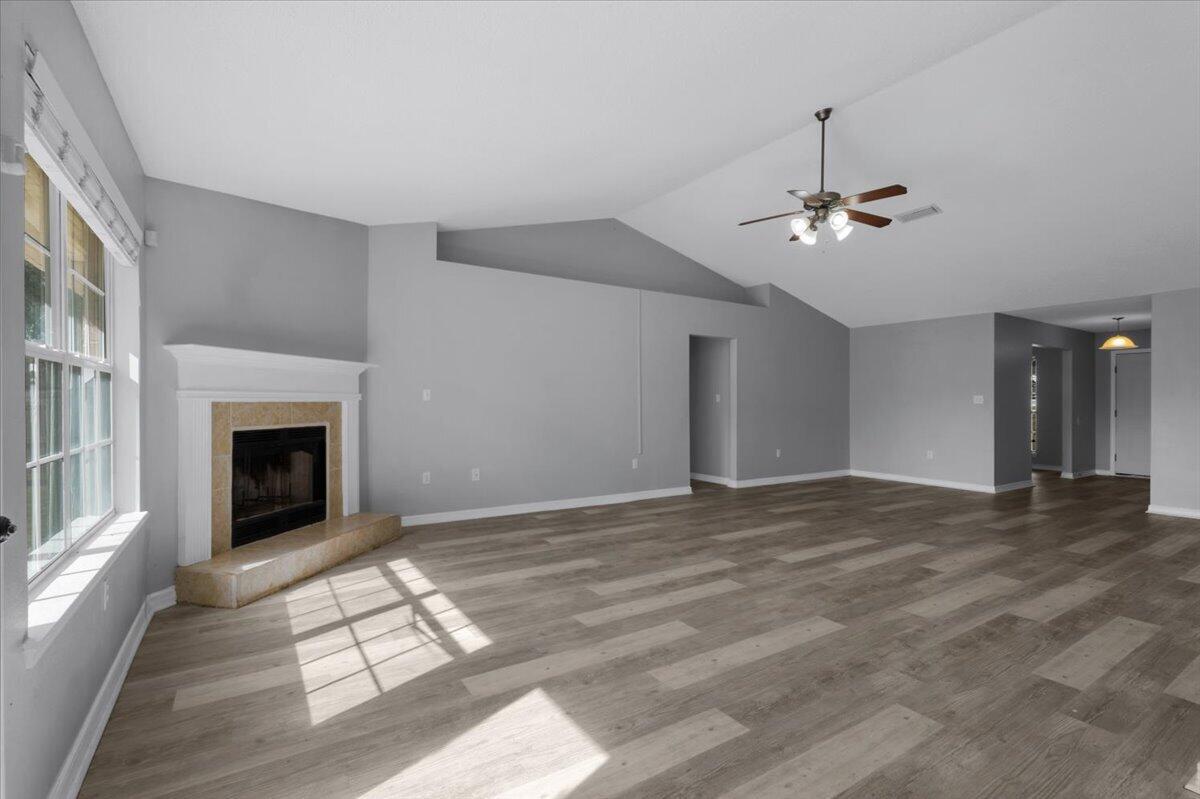 427 Triton Street Crestview, FL 32536 - Photo 8 of 43 a view of an empty room with window and fire place