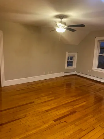 a view of a livingroom with wooden floor
