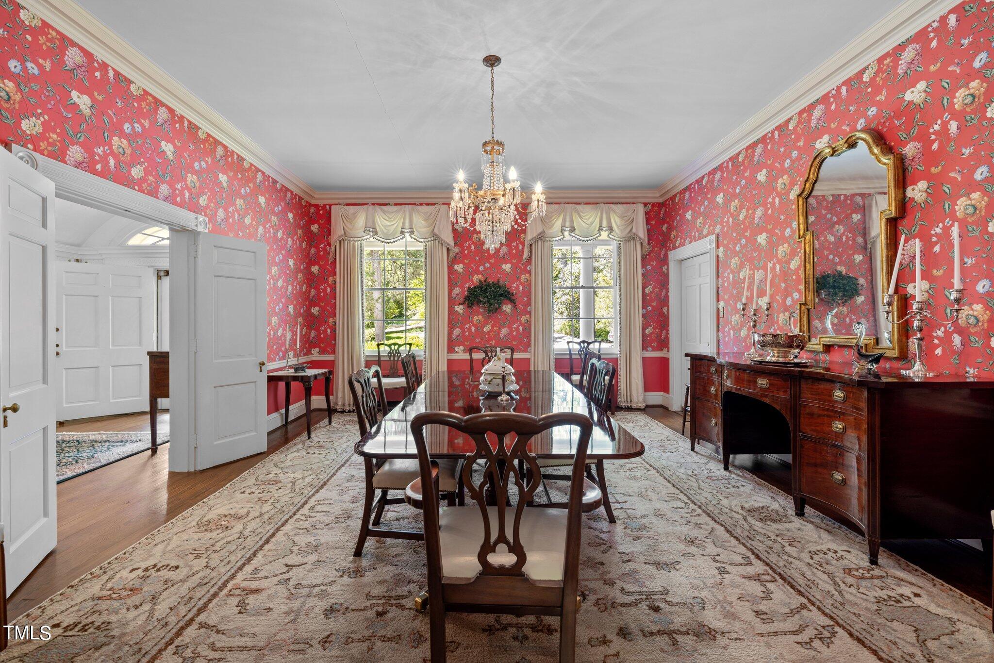 3116 Cornwall Road Durham, NC 27707 - Photo 13 of 85 a view of a dining room with furniture and chandelier