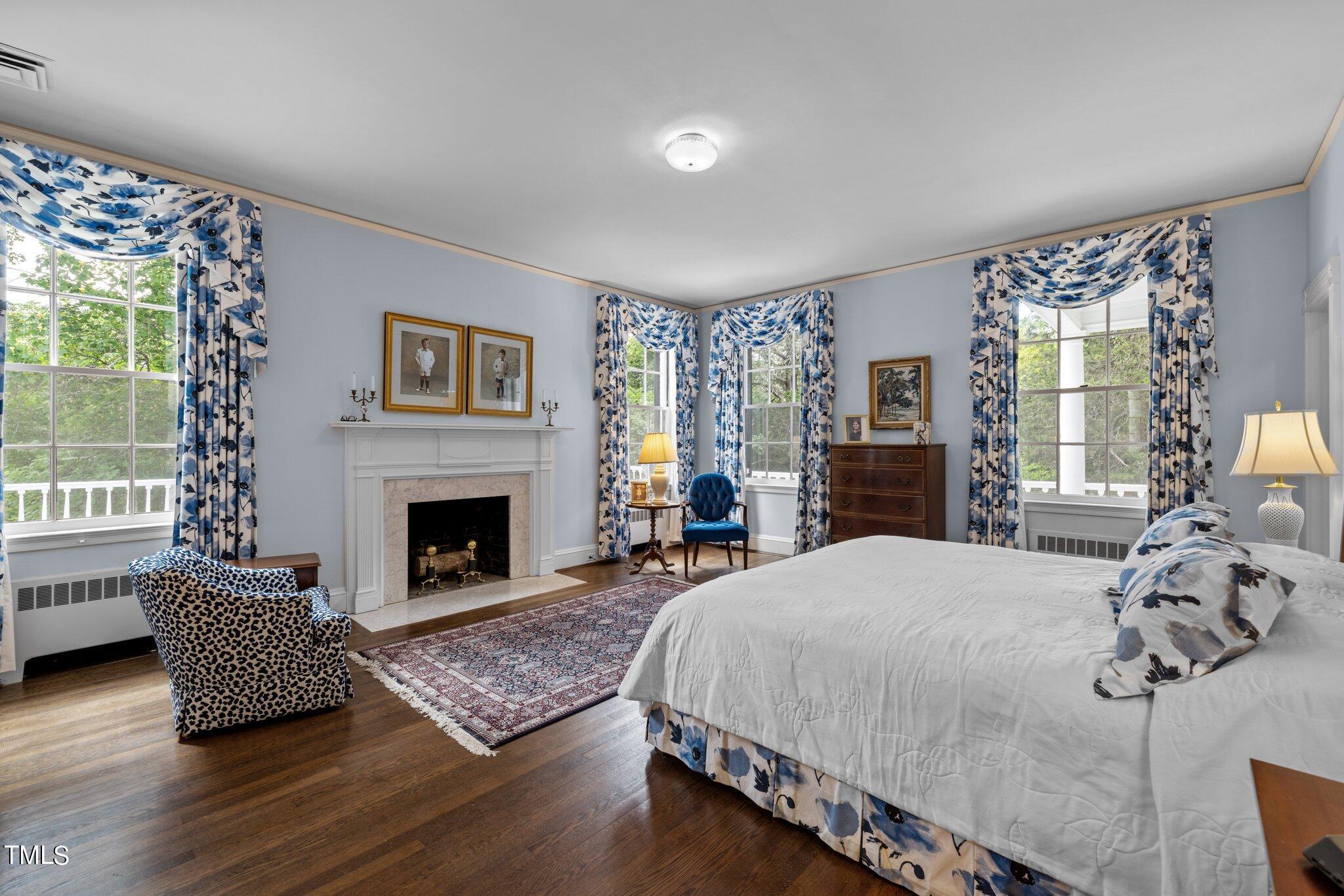 3116 Cornwall Road Durham, NC 27707 - Photo 36 of 85 a bedroom with a bed and a fireplace