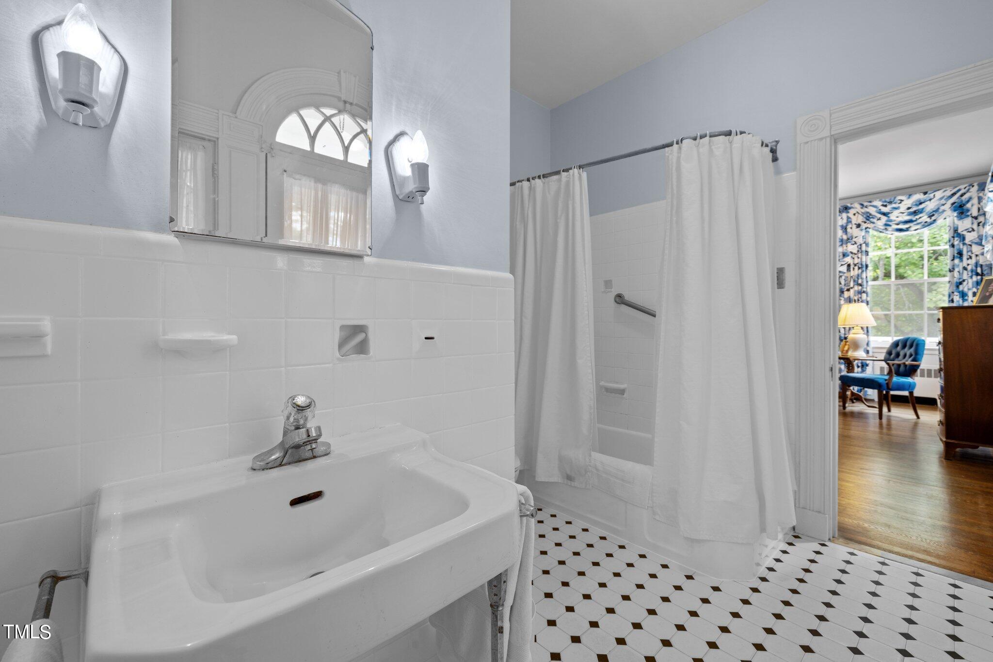 3116 Cornwall Road Durham, NC 27707 - Photo 39 of 85 a bathroom with a sink a toilet and shower