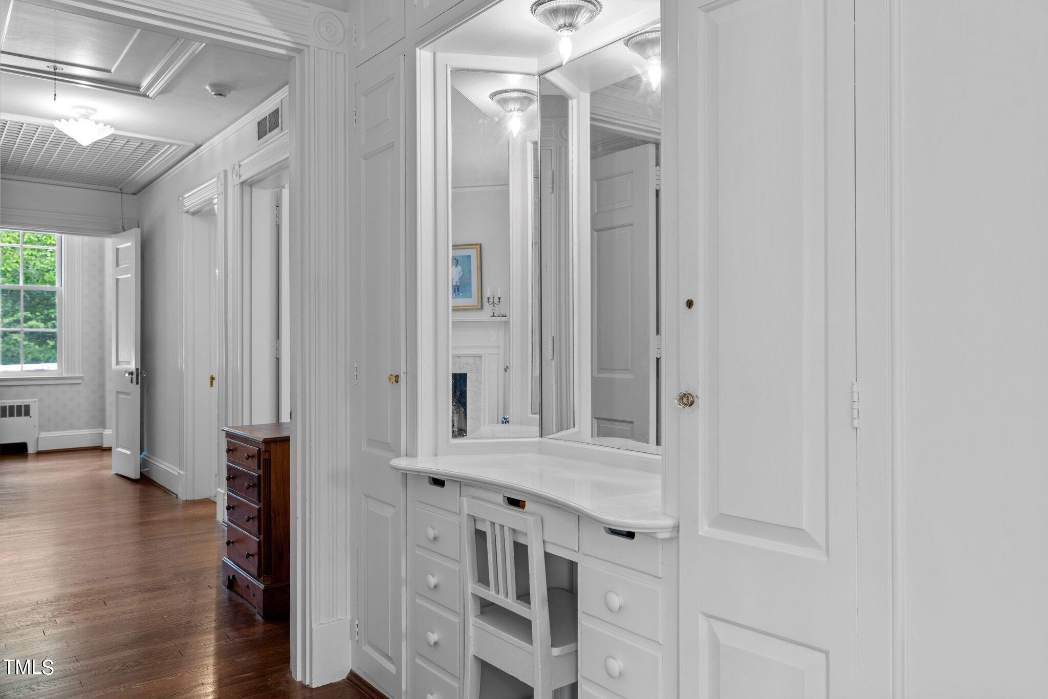3116 Cornwall Road Durham, NC 27707 - Photo 41 of 85 a view of a hallway with wooden floor and windows