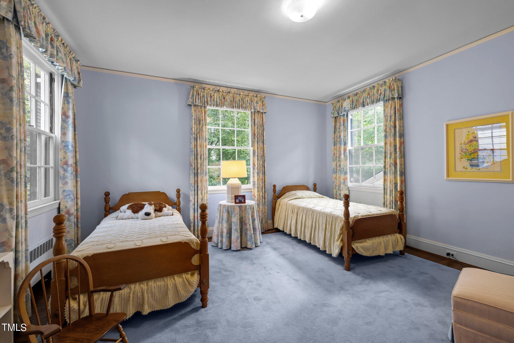 3116 Cornwall Road Durham, NC 27707 - Photo 42 of 85 a bedroom with a bed and a window