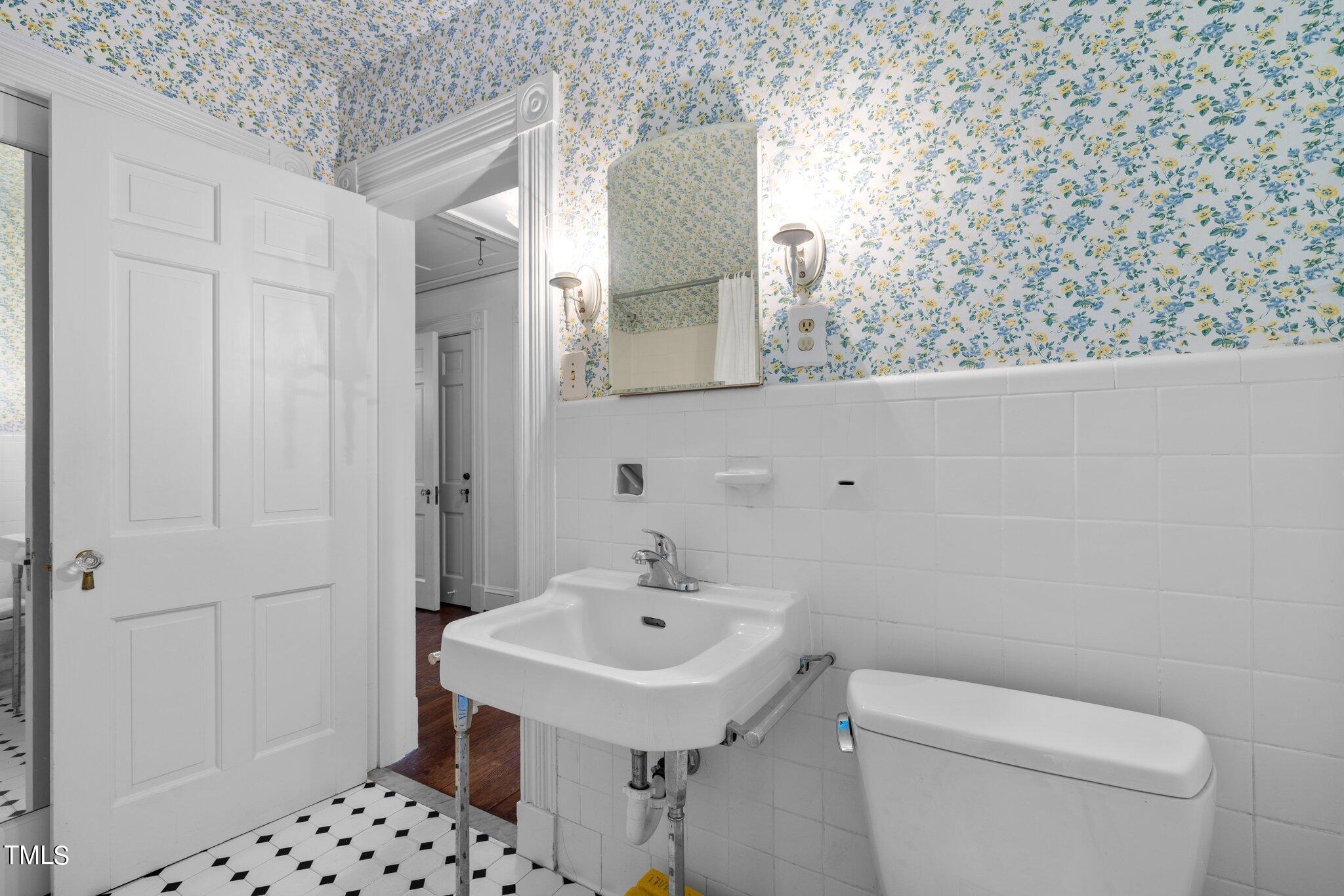 3116 Cornwall Road Durham, NC 27707 - Photo 45 of 85 a bathroom with a sink a toilet and shower