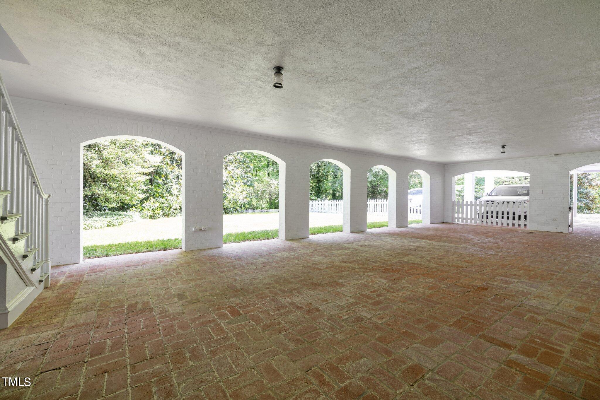 3116 Cornwall Road Durham, NC 27707 - Photo 51 of 85 a view of an empty room with a windows and a fireplace